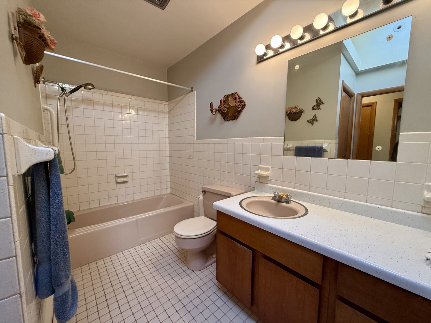 2052 County Road 3000 North Rantoul, IL 61866 - Photo 15 of 21 a bathroom with a sink a toilet a mirror a bathtub and shower