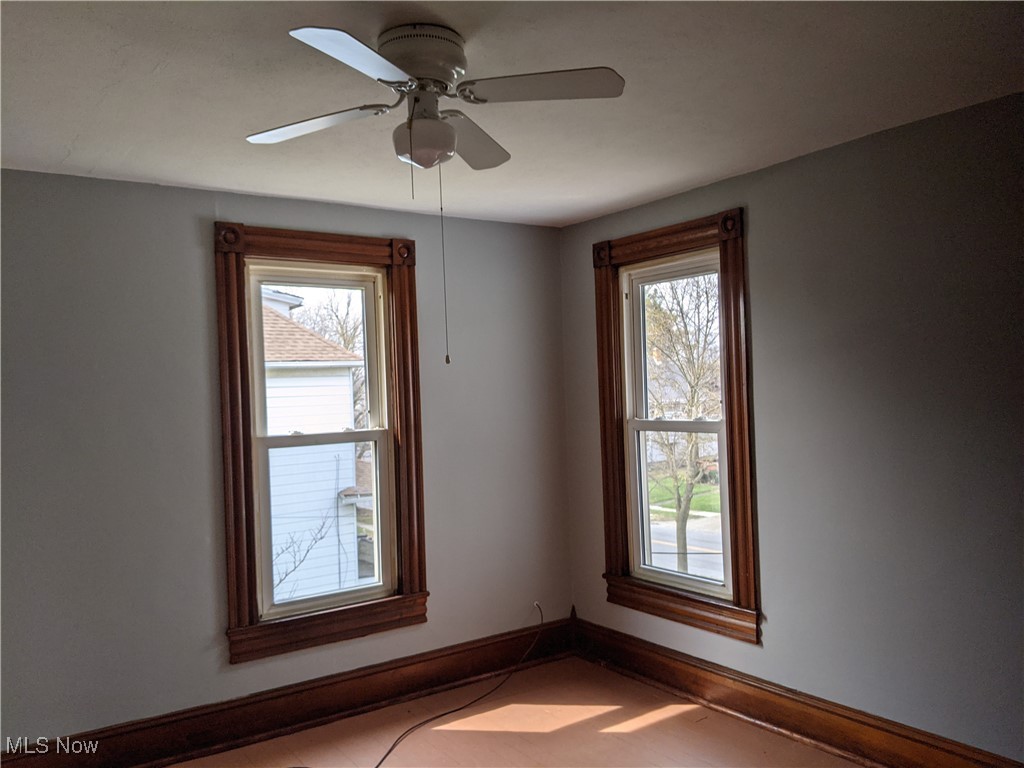 70 Center Road Bedford, OH 44146 - Photo 14 of 18 Unfurnished room with ceiling fan