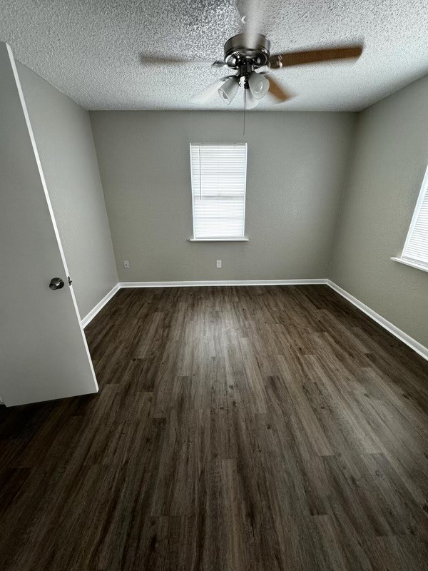 717 6th Street San Leon, TX 77539 - Photo 4 of 8 wooden floor in an empty room with a window