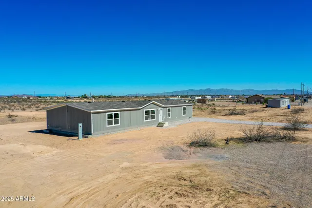 a view of residential houses with an ocean view