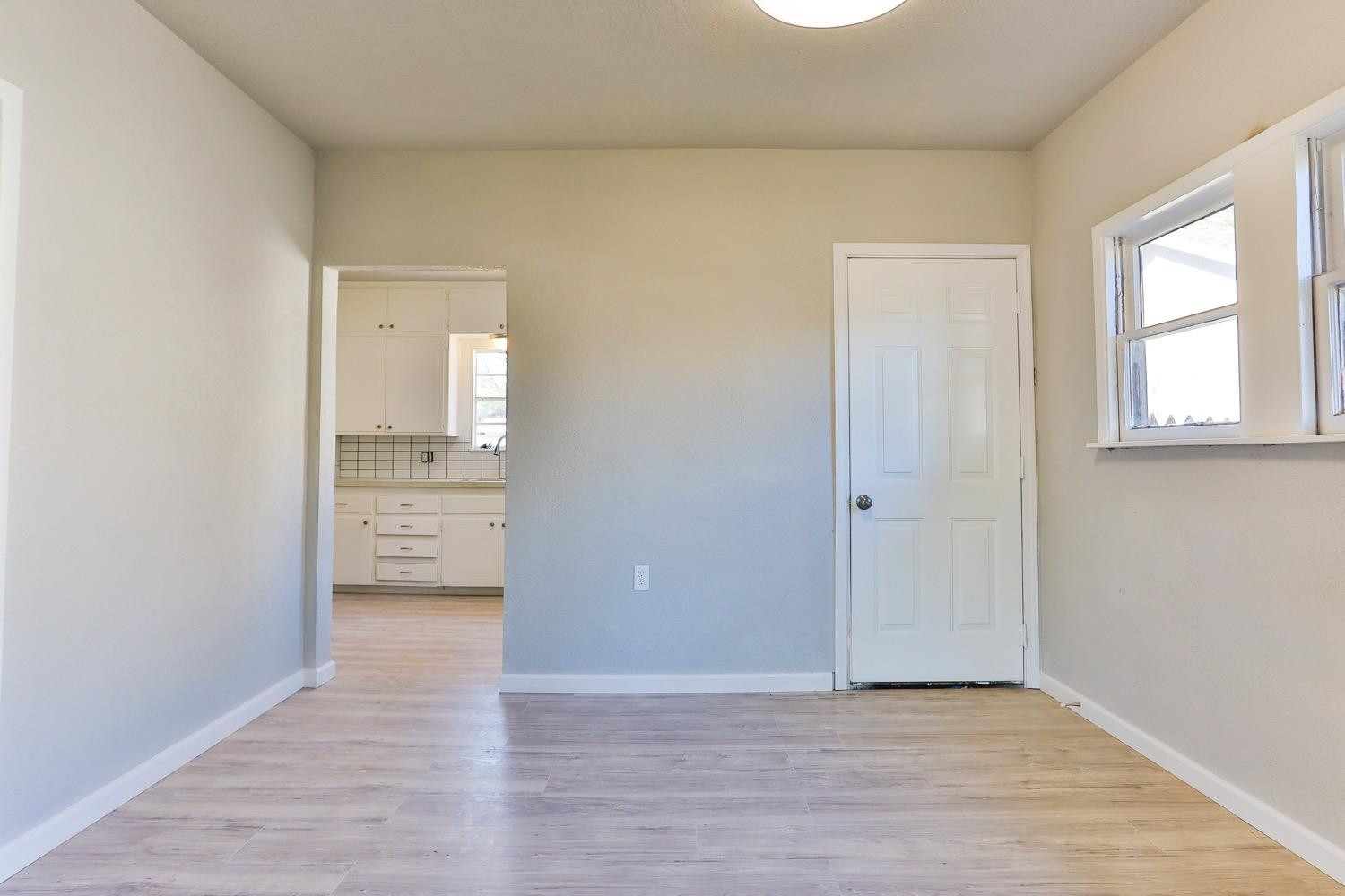 435 West Lynn Street Slaton, TX 79364 - Photo 10 of 22 a view of an empty room and window
