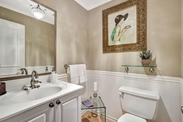 an aerial view of a house with swimming pool a yard and lake view