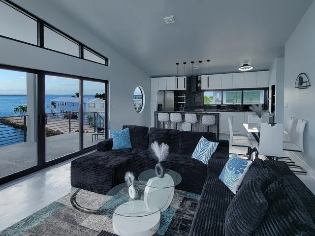 a kitchen with stainless steel appliances granite countertop a sink and a stove