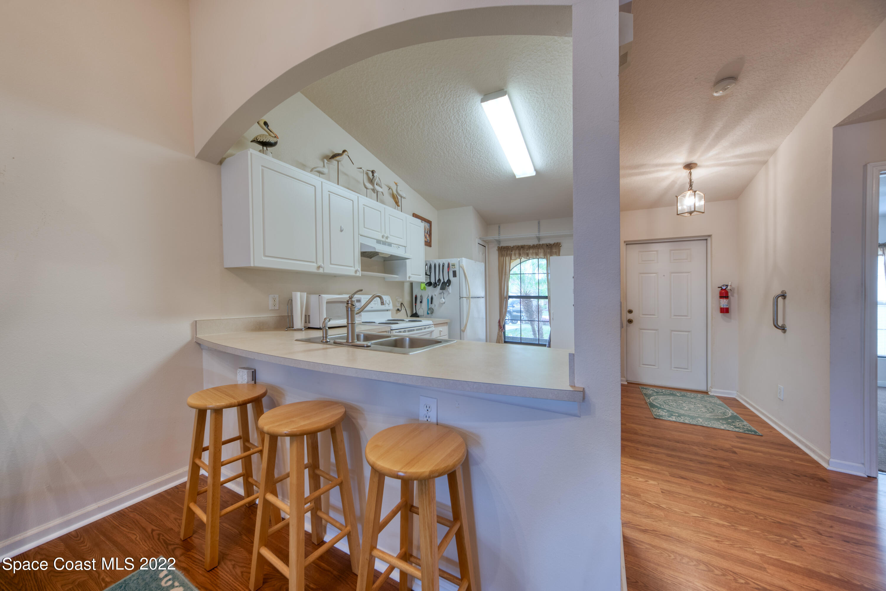 995 Luminary Circle, Unit 103 Melbourne, FL 32901 - Photo 11 of 27 a bathroom with a sink and a mirror