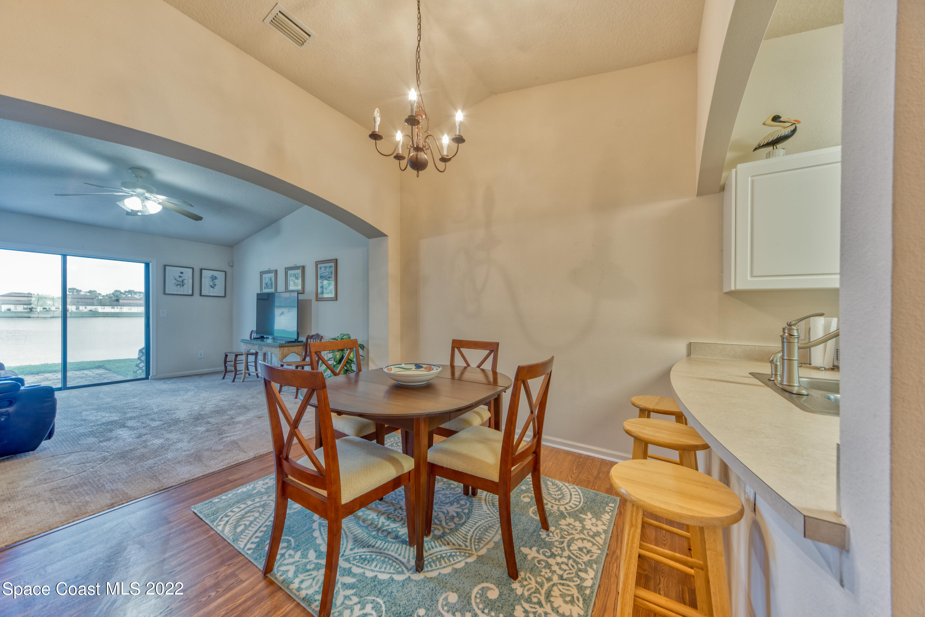 995 Luminary Circle, Unit 103 Melbourne, FL 32901 - Photo 12 of 27 a view of a dining room with furniture and window