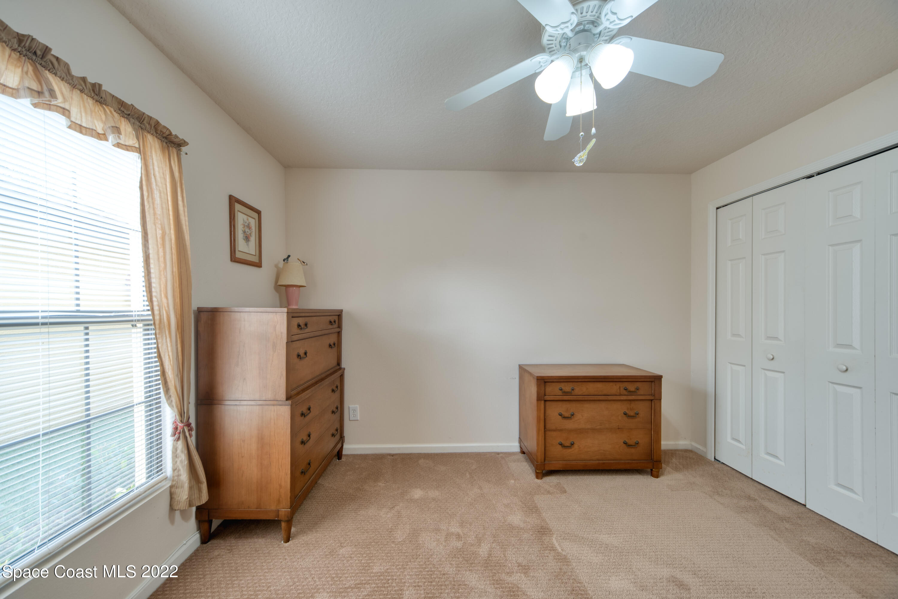 995 Luminary Circle, Unit 103 Melbourne, FL 32901 - Photo 14 of 27 a view of an empty room with a window