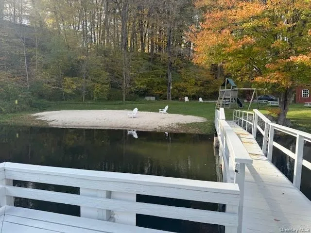 a view of swimming pool with a lake view