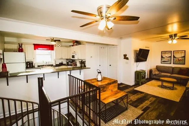 a kitchen with stainless steel appliances granite countertop a stove and white cabinets