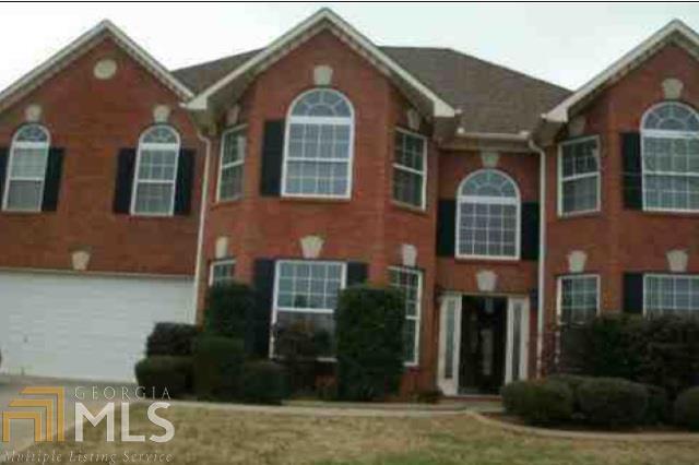 1724 Rising View Circle McDonough, GA 30253 - Photo 1 of 1 a front view of a house with garden