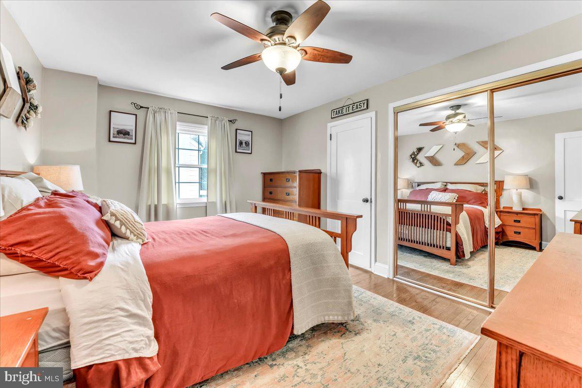 2277 Mill Road Upper Chichester, PA 19061 - Photo 13 of 30 a bedroom with a bed and wooden floor