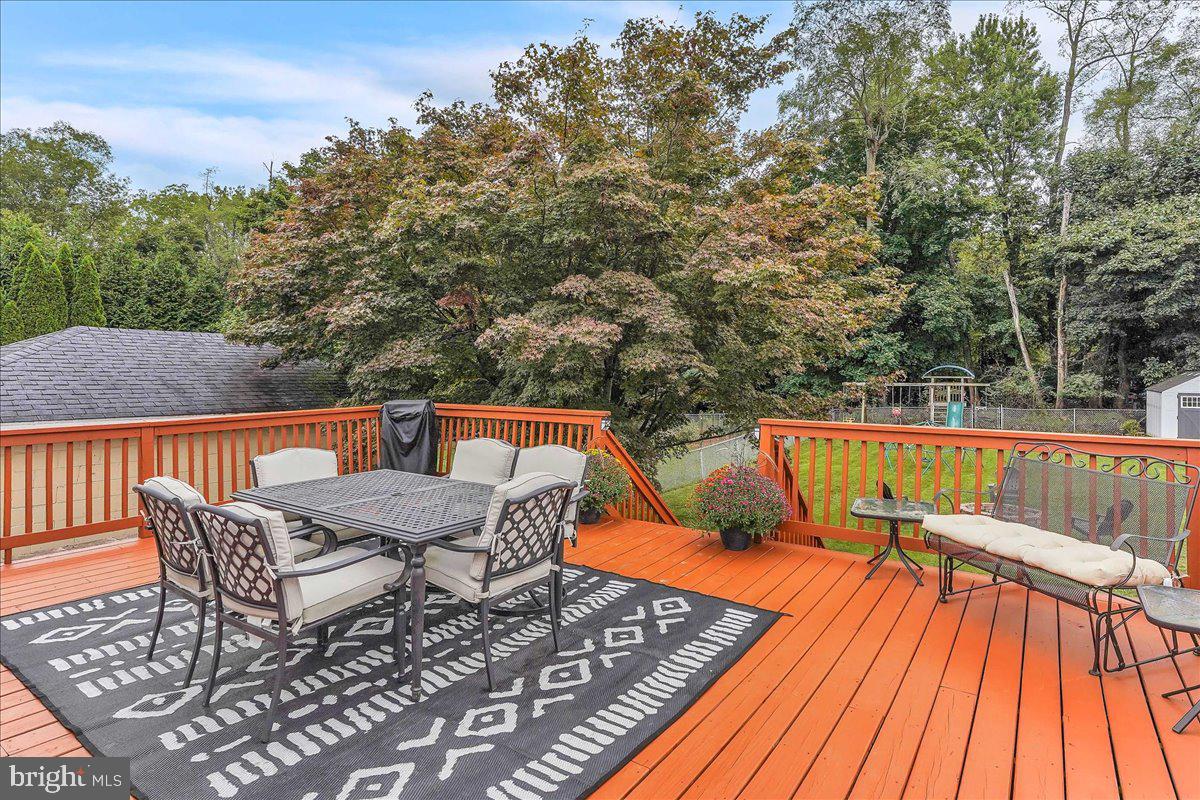 2277 Mill Road Upper Chichester, PA 19061 - Photo 23 of 30 a view of balcony with wooden floor and outdoor seating