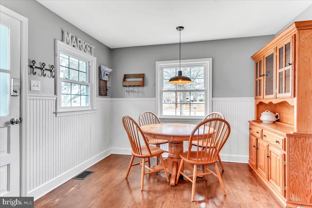 2277 Mill Road Upper Chichester, PA 19061 - Photo 8 of 30 a view of a dining room with furniture window and wooden floor