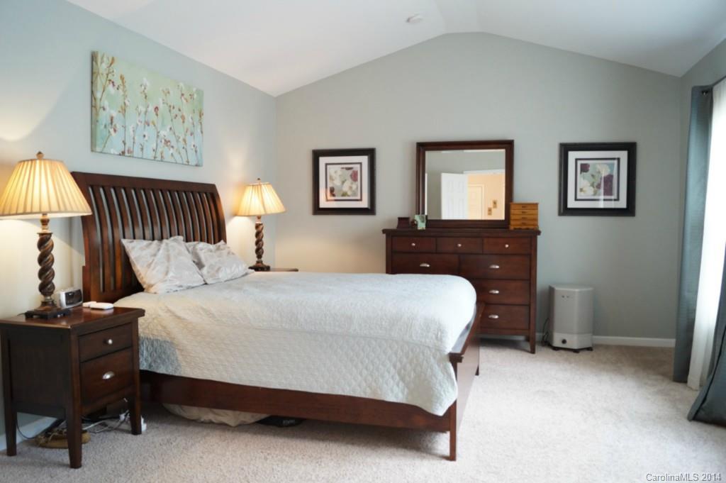 2224 Winthorp Ridge Road Charlotte, NC 28270 - Photo 11 of 24 a bedroom with a bed and a lamp on dresser
