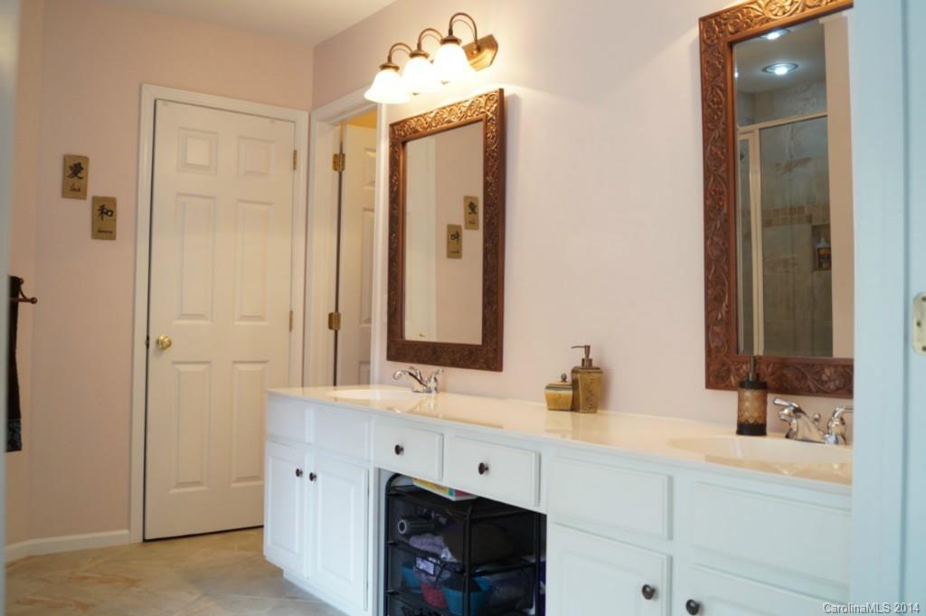2224 Winthorp Ridge Road Charlotte, NC 28270 - Photo 13 of 24 a bathroom with a sink and a mirror