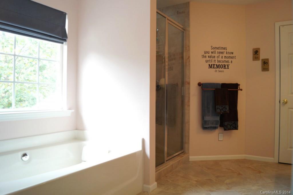 2224 Winthorp Ridge Road Charlotte, NC 28270 - Photo 14 of 24 a view of a hallway with wooden floor and windows