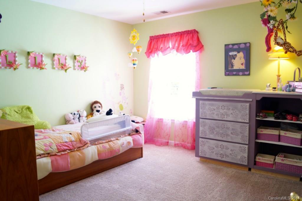 2224 Winthorp Ridge Road Charlotte, NC 28270 - Photo 15 of 24 a bedroom with a bed and a bookshelf
