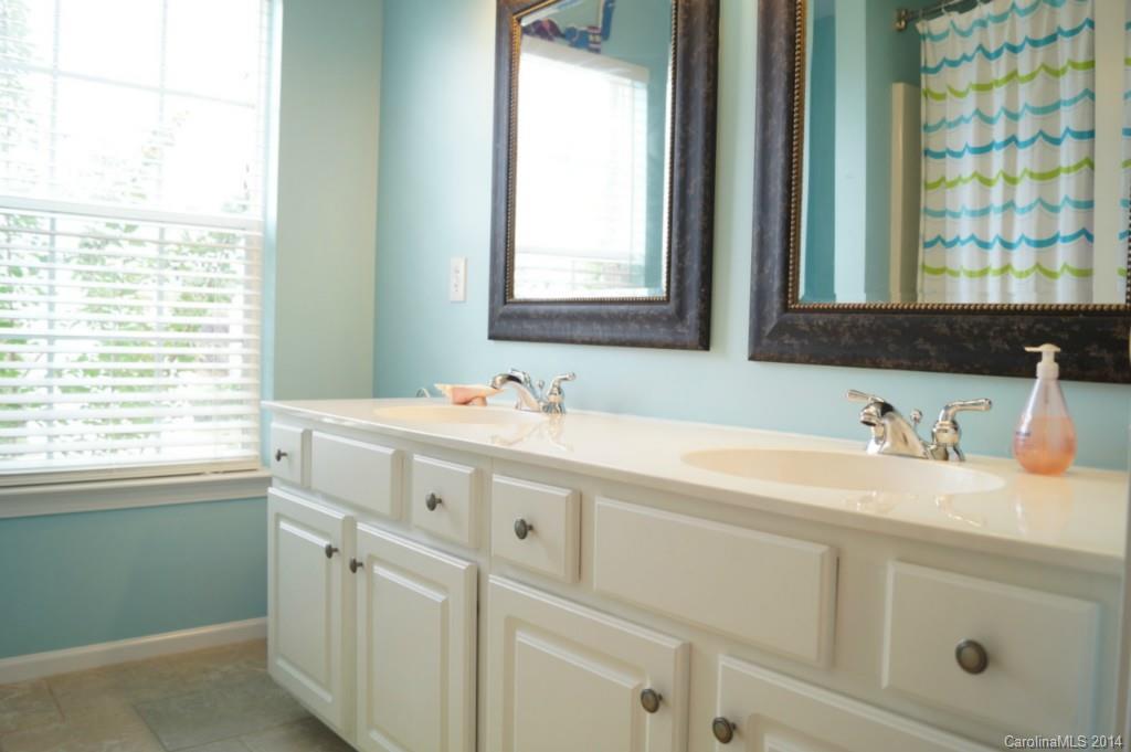 2224 Winthorp Ridge Road Charlotte, NC 28270 - Photo 16 of 24 a bathroom with a sink and a window
