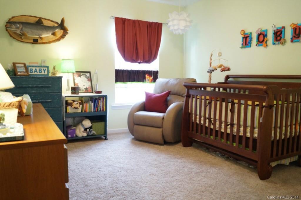2224 Winthorp Ridge Road Charlotte, NC 28270 - Photo 19 of 24 a bedroom with a bed and a painting on the wall