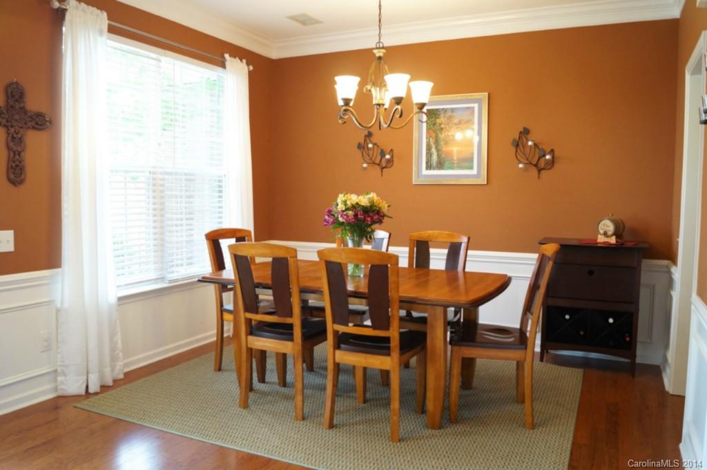 2224 Winthorp Ridge Road Charlotte, NC 28270 - Photo 3 of 24 a dining room with furniture a chandelier and wooden floor