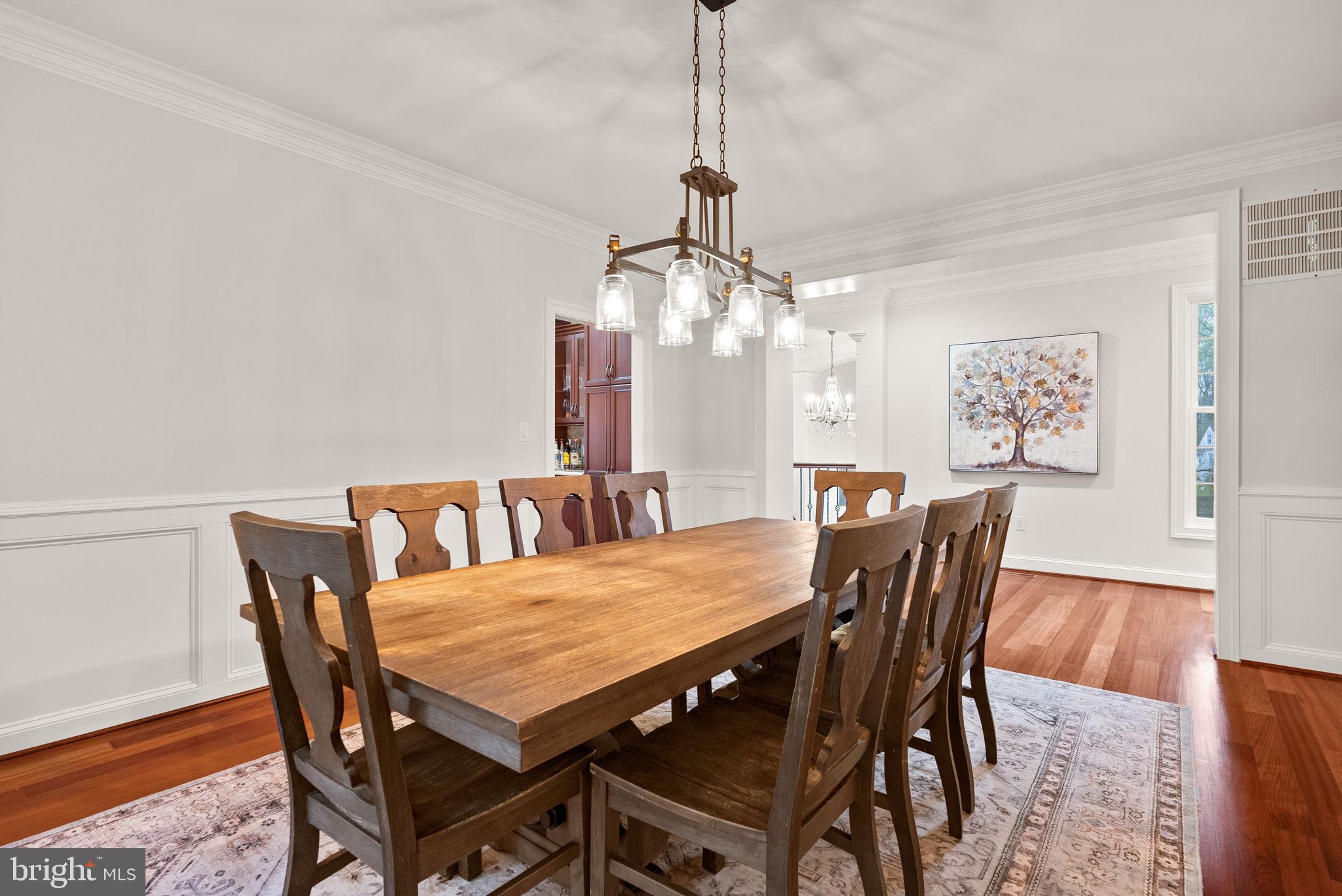 8522 Lewinsville Road McLean, VA 22102 - Photo 12 of 51 a view of a dining room with furniture and wooden floor