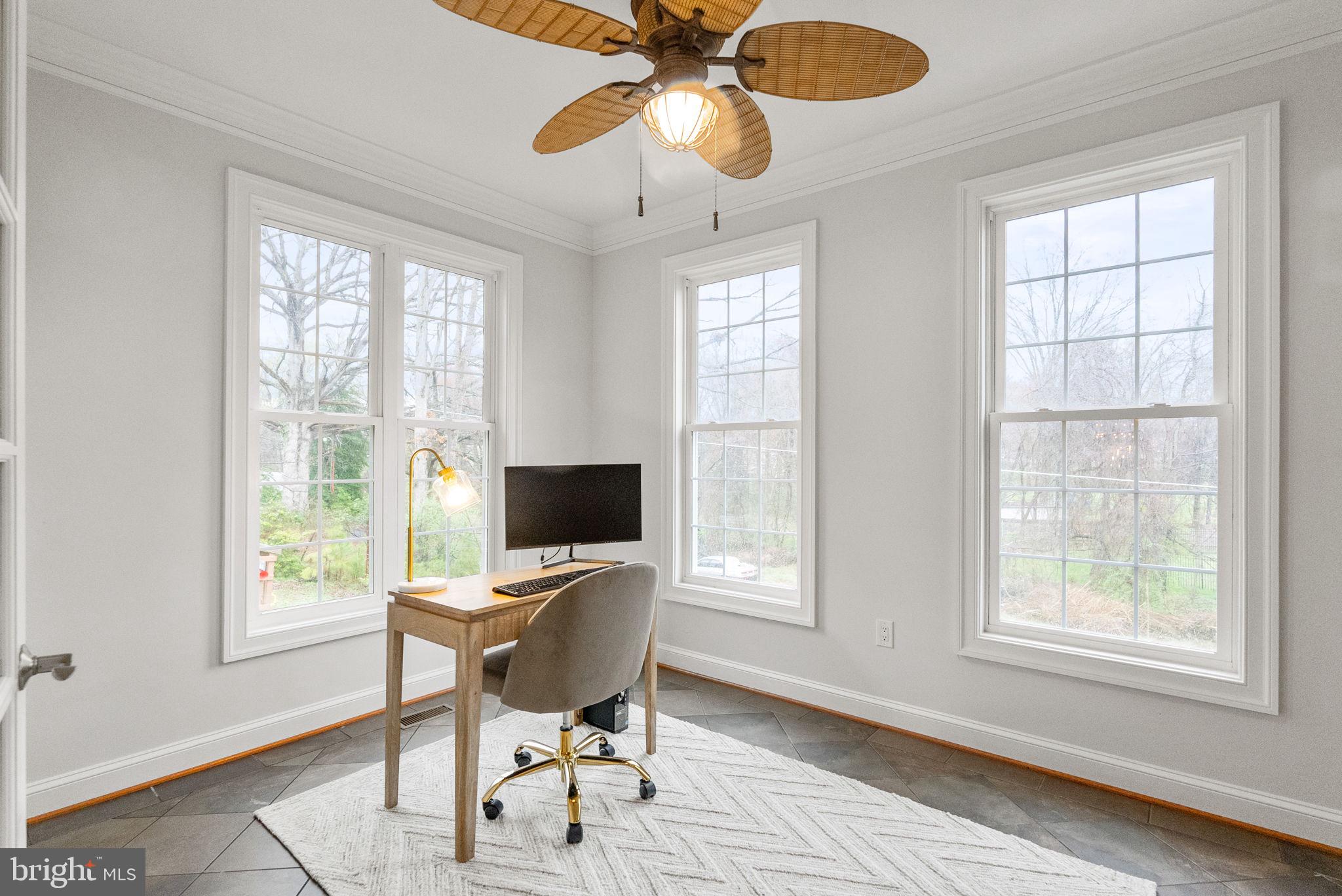 8522 Lewinsville Road McLean, VA 22102 - Photo 13 of 51 a view of a workspace with furniture and a window