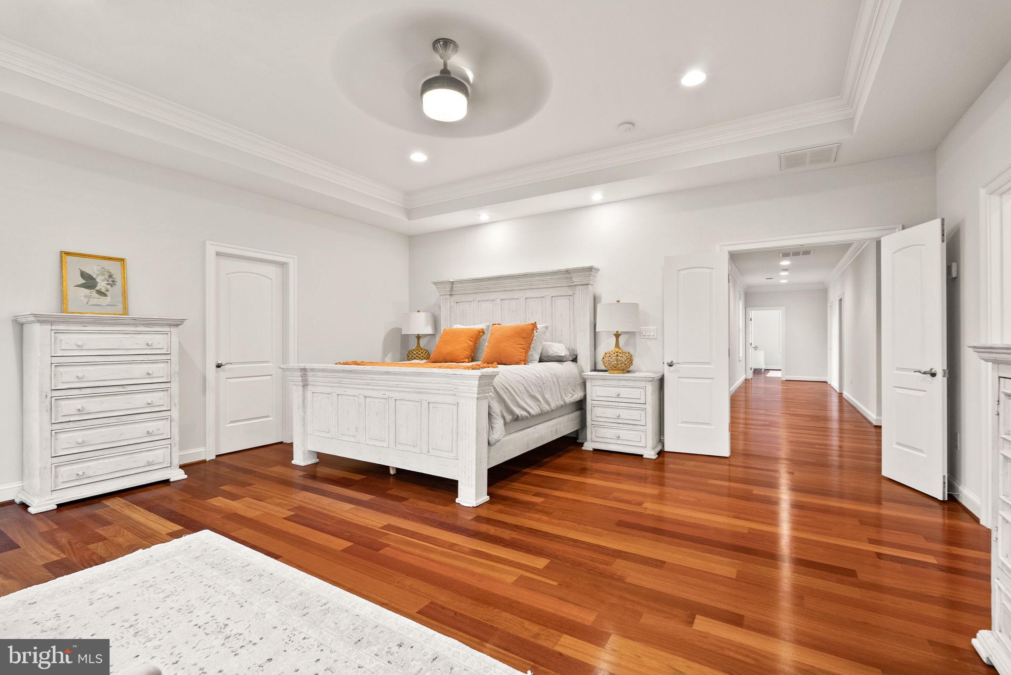 8522 Lewinsville Road McLean, VA 22102 - Photo 17 of 51 a bedroom with a bed and wooden floor