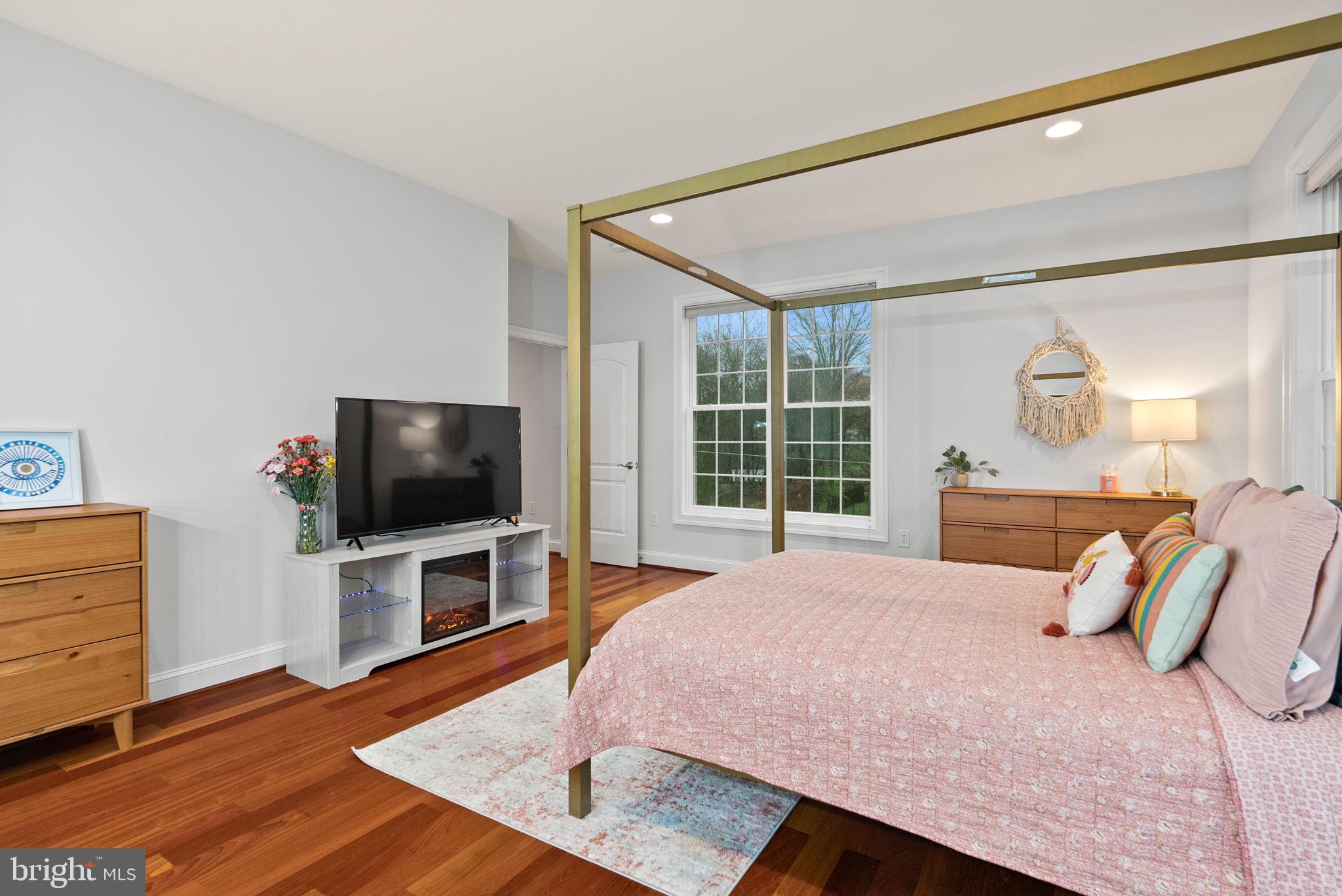 8522 Lewinsville Road McLean, VA 22102 - Photo 27 of 51 a bedroom with a bed and a flat screen tv