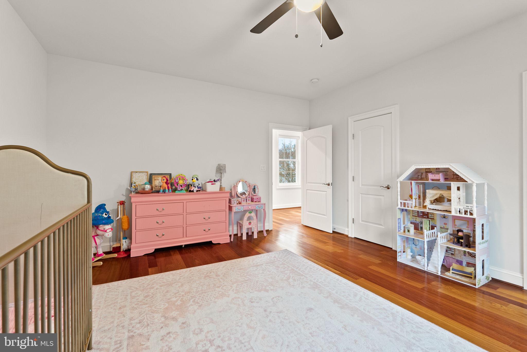 8522 Lewinsville Road McLean, VA 22102 - Photo 30 of 51 a bedroom with furniture and a book shelf