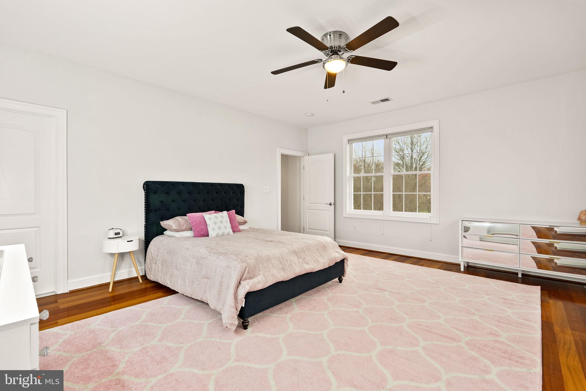 8522 Lewinsville Road McLean, VA 22102 - Photo 32 of 51 a bedroom with a bed and a window