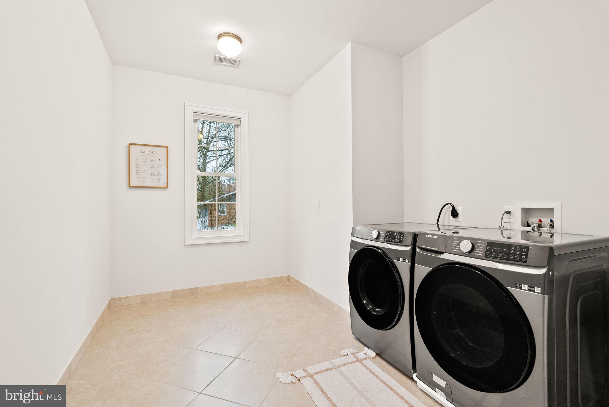 8522 Lewinsville Road McLean, VA 22102 - Photo 39 of 51 a utility room with dryer and washer