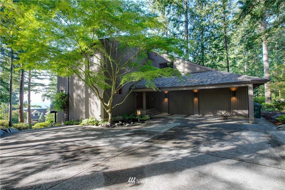 a view of a house with a tree