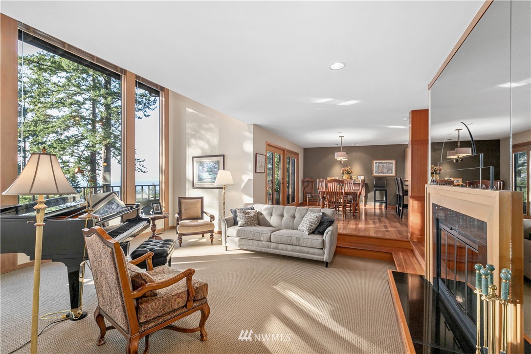 629 Fieldston Road Bellingham, WA 98225 - Photo 14 of 25 a living room with fireplace furniture and a large window