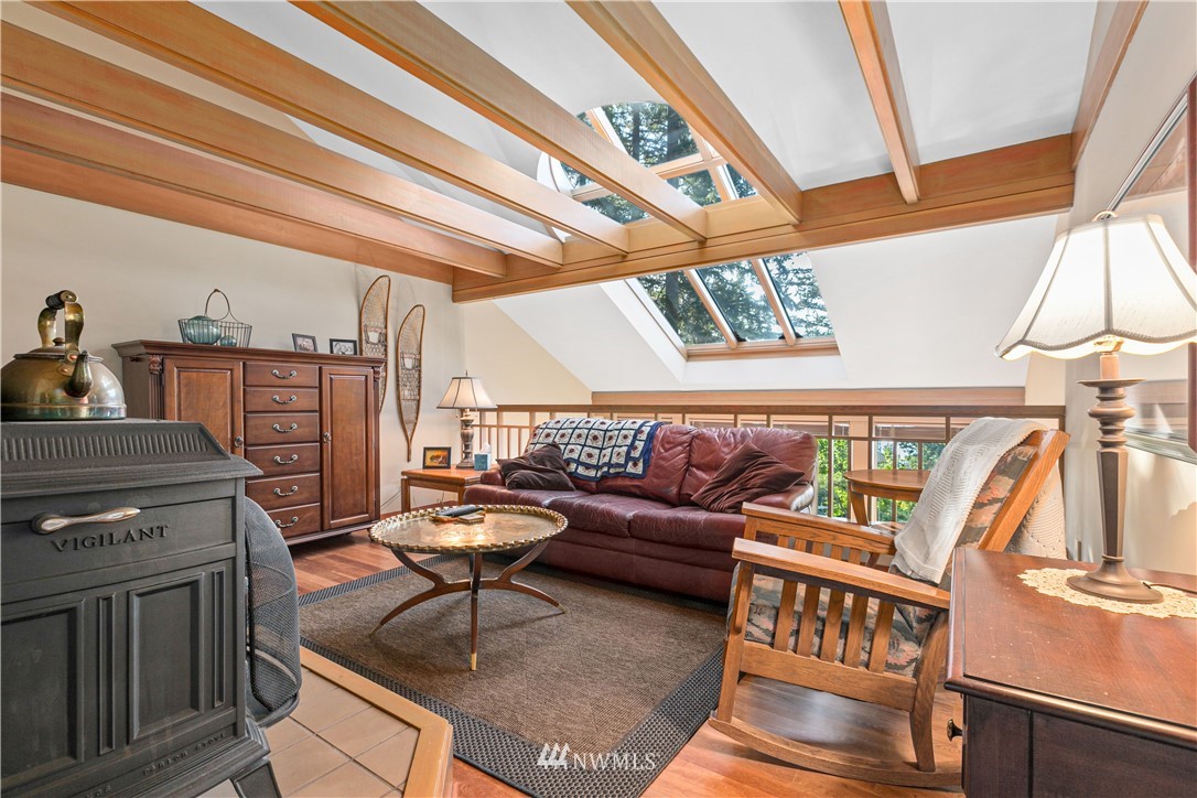629 Fieldston Road Bellingham, WA 98225 - Photo 23 of 25 a living room with furniture and a fireplace