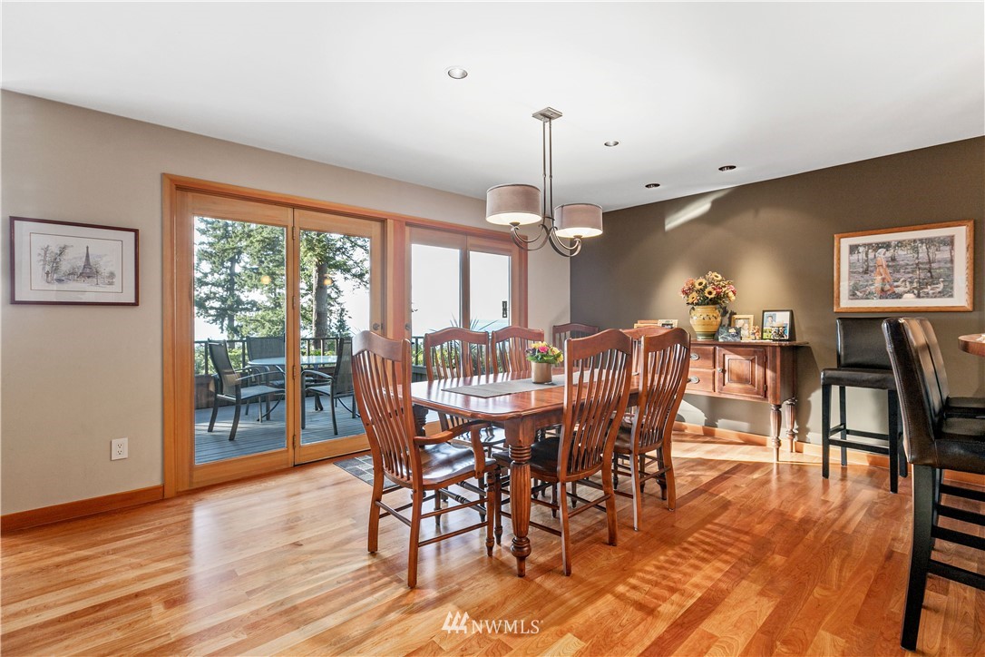 629 Fieldston Road Bellingham, WA 98225 - Photo 9 of 25 a view of a dining room with furniture window and wooden floor