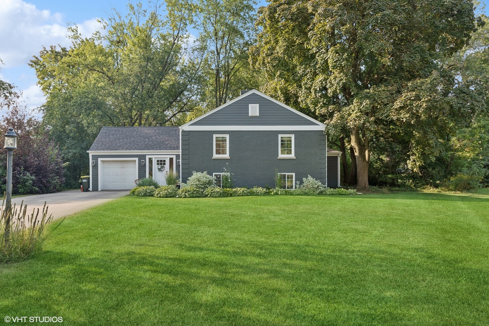 205 West Willow Road Prospect Heights, IL 60070 - Photo 1 of 30 a front view of a house with yard and green space
