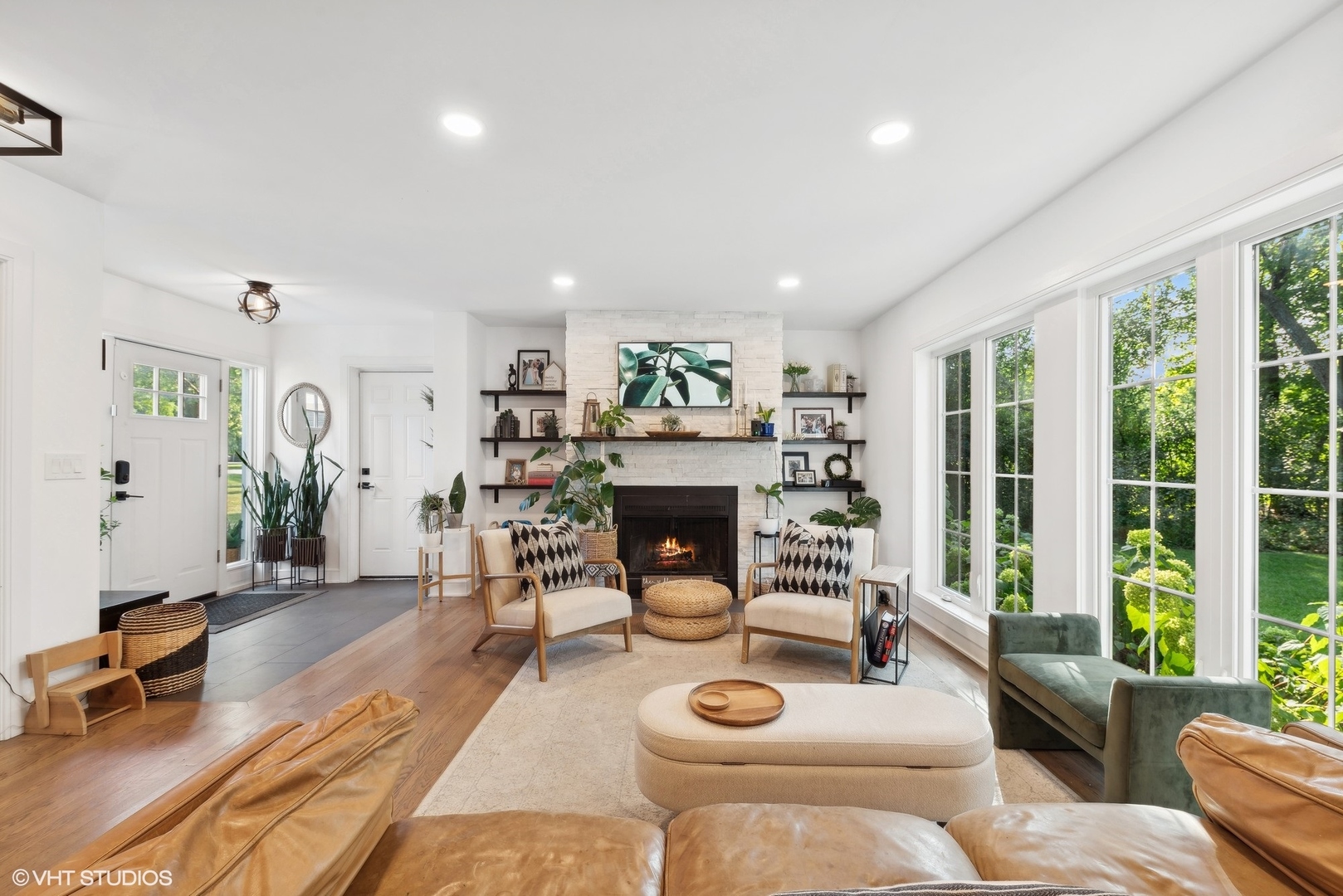 205 West Willow Road Prospect Heights, IL 60070 - Photo 6 of 30 a living room with furniture a fireplace and a large window
