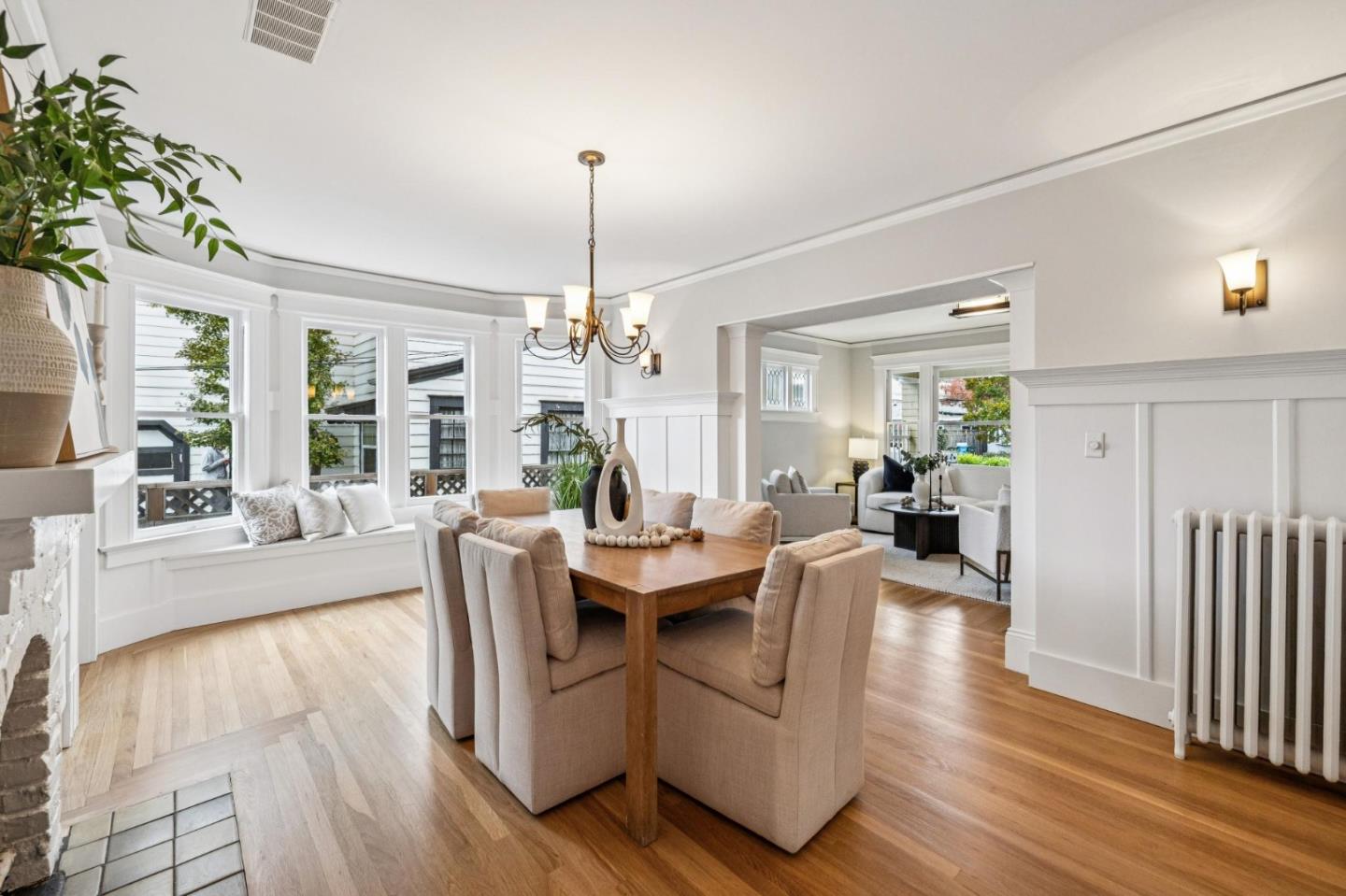 712 Crossway Road Burlingame, CA 94010 - Photo 28 of 90 a living room with fireplace furniture and a wooden floor