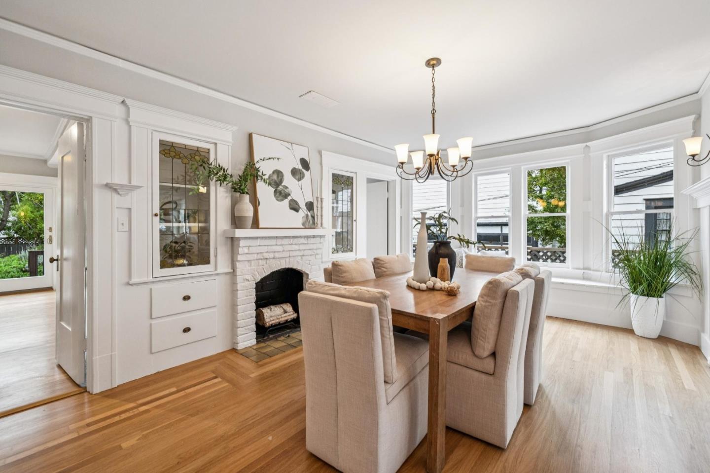 712 Crossway Road Burlingame, CA 94010 - Photo 29 of 90 a view of a dining room with furniture window and wooden floor