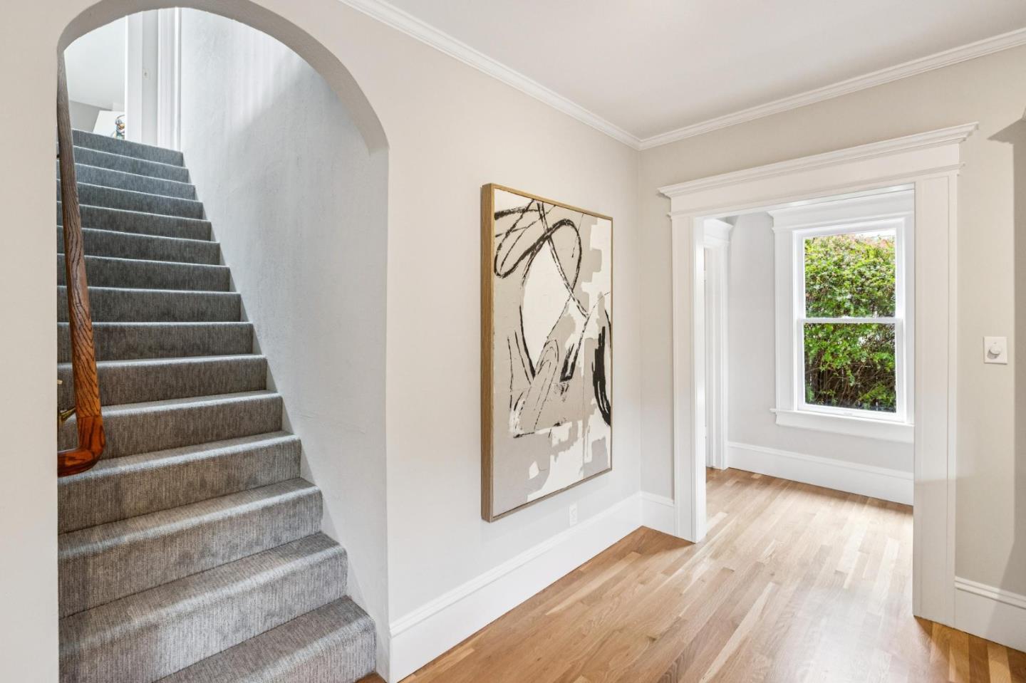 712 Crossway Road Burlingame, CA 94010 - Photo 53 of 90 a view of an entryway with wooden floor and windows