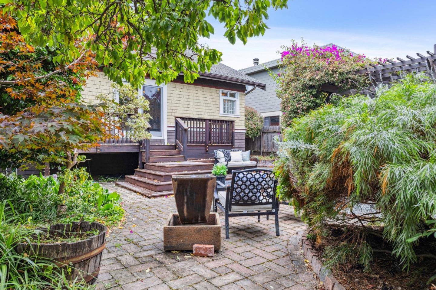 712 Crossway Road Burlingame, CA 94010 - Photo 79 of 90 a view of a backyard with sitting area and garden