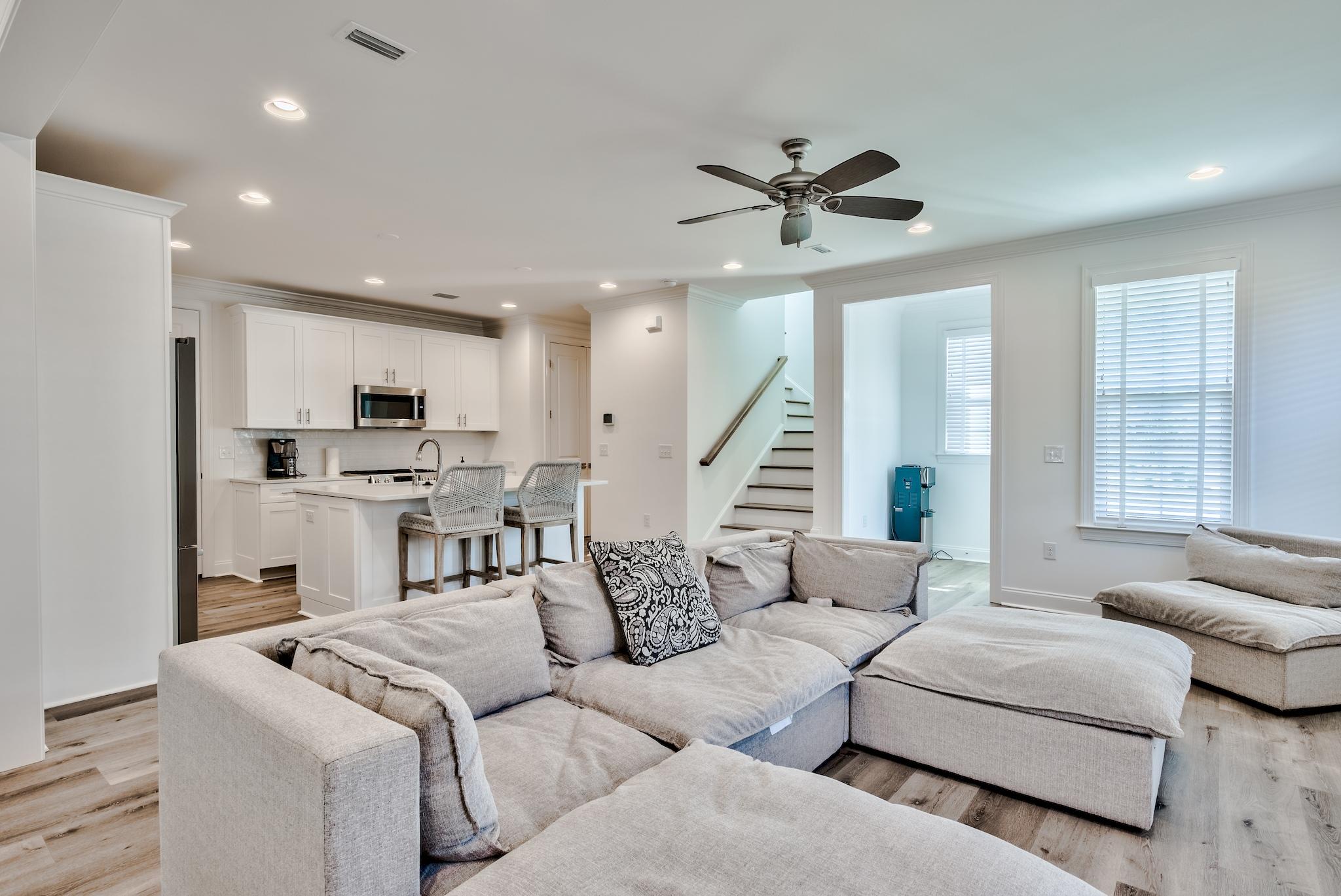 25 Cambium Court Watersound, FL 32461 - Photo 2 of 23 a living room with furniture and a large window