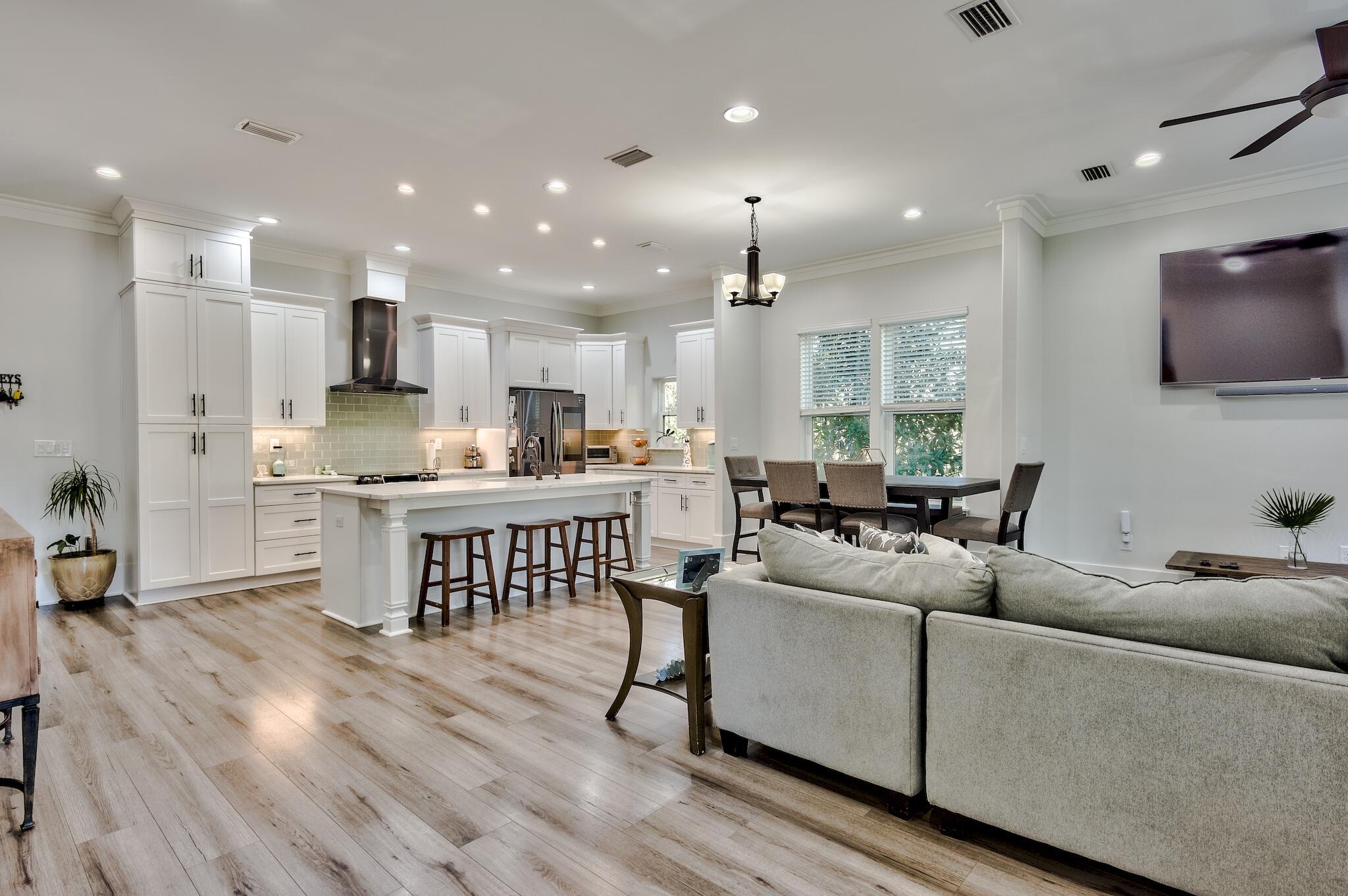 25 Cambium Court Watersound, FL 32461 - Photo 9 of 23 a living room with furniture and a flat screen tv