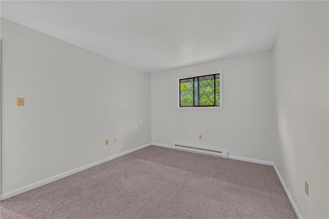 1570 Astolat Road Effort, PA 18330 - Photo 40 of 48 Wall-to-wall carpeting and neutral plaster walls define this versatile bedroom space.