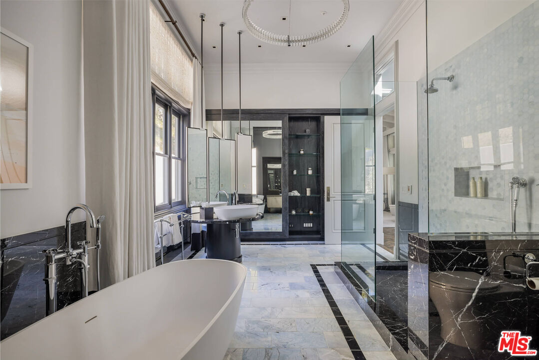9779 Oak Pass Road Beverly Hills, CA 90210 - Photo 20 of 43 a very nice looking dining room with a large window and stainless steel appliances