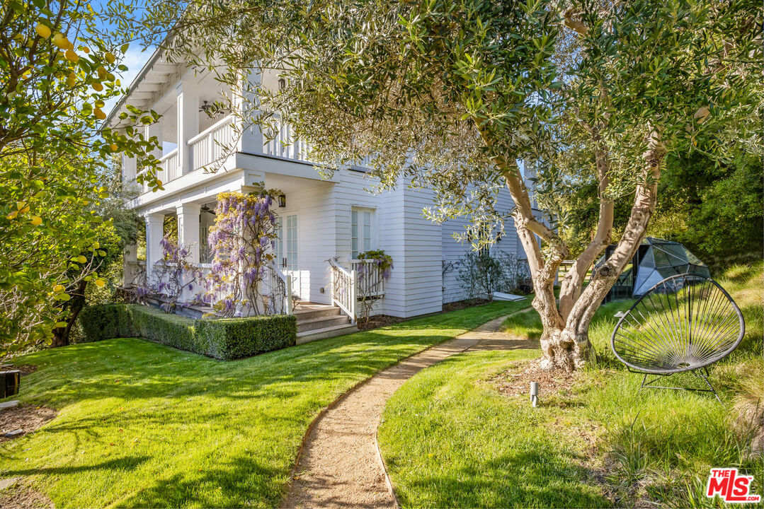 9779 Oak Pass Road Beverly Hills, CA 90210 - Photo 34 of 43 a view of a house with a big yard