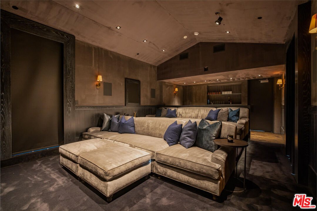 9779 Oak Pass Road Beverly Hills, CA 90210 - Photo 39 of 43 a living room with furniture and a fireplace