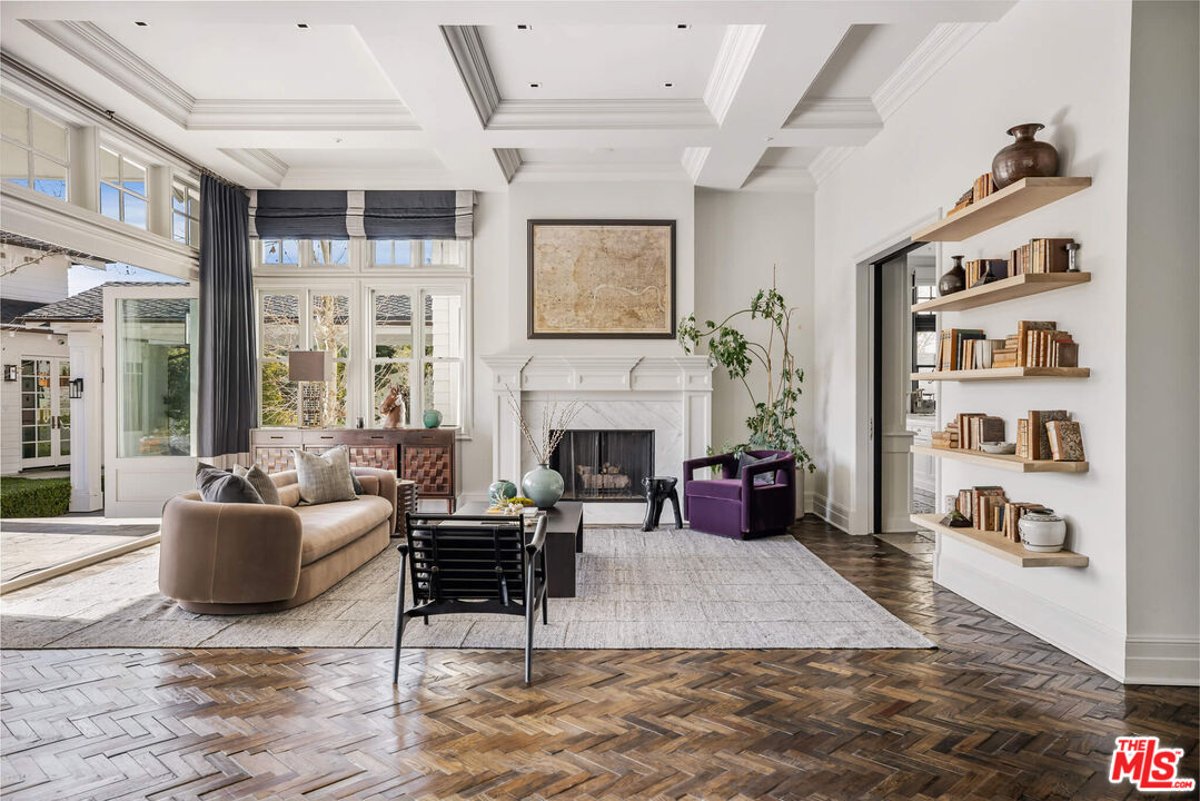 9779 Oak Pass Road Beverly Hills, CA 90210 - Photo 4 of 43 a living room with furniture and a fireplace
