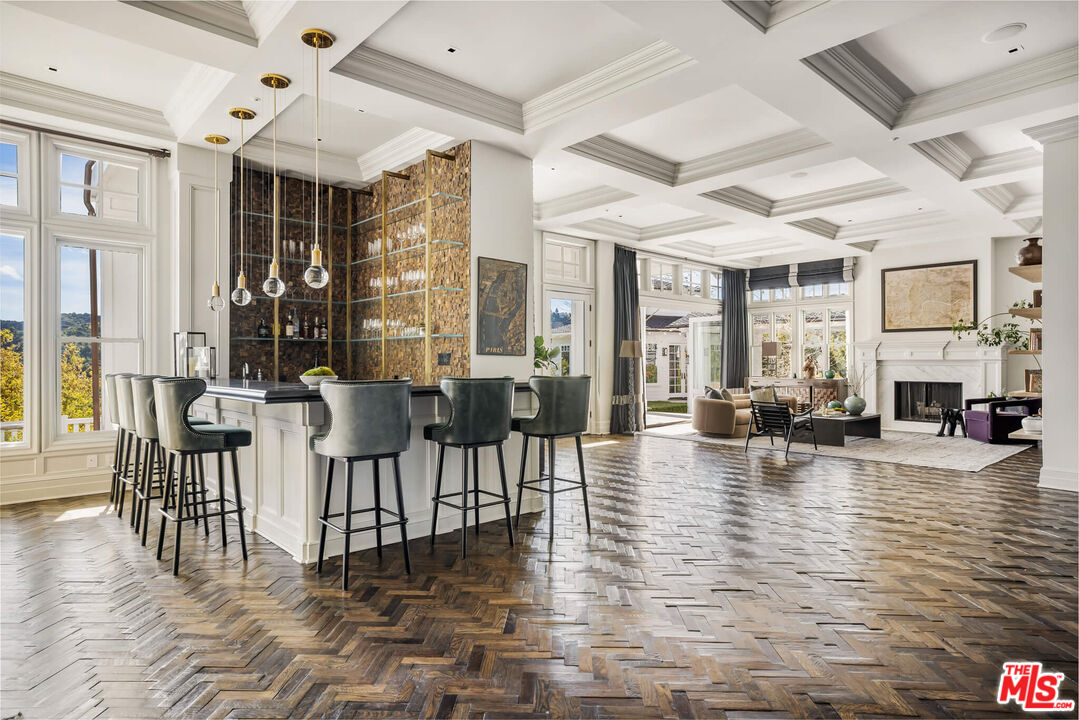 9779 Oak Pass Road Beverly Hills, CA 90210 - Photo 5 of 43 a view of a dining room with furniture window and wooden floor