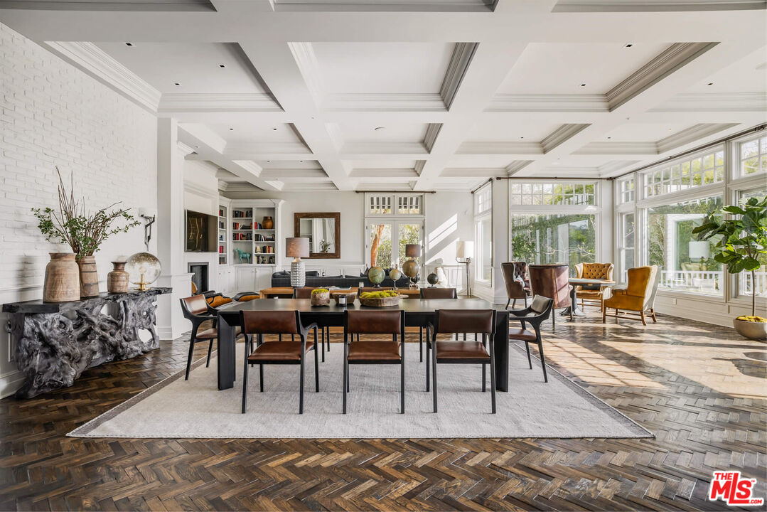 9779 Oak Pass Road Beverly Hills, CA 90210 - Photo 6 of 43 a view of a dining room with furniture