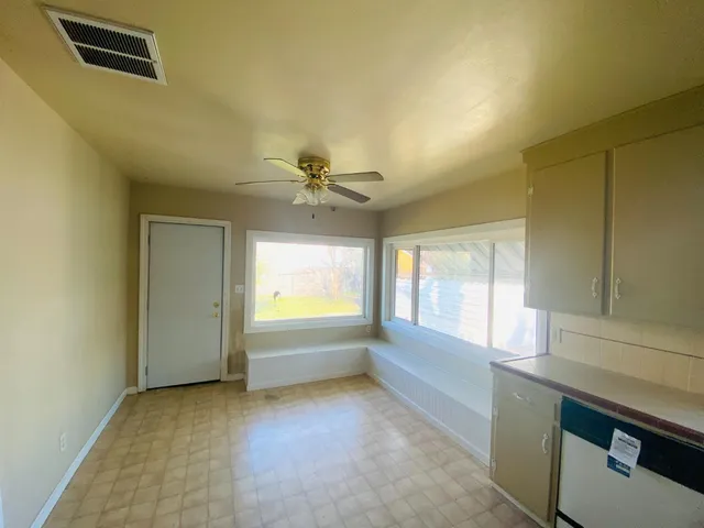 a view of an empty room and window